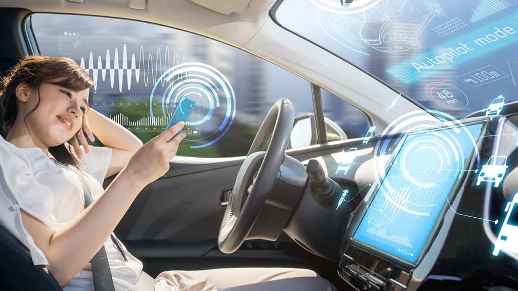 Credit Unions - woman driving autonomous car
