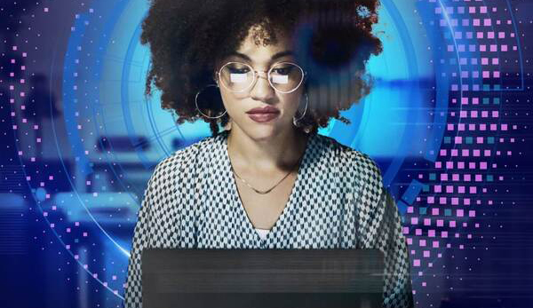 Women viewing her laptop with a technology inspired background