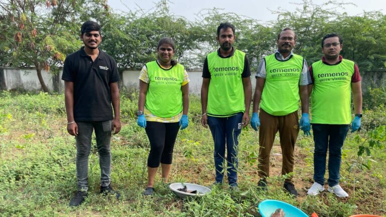 photos of temenos employees picking up debris on earth day