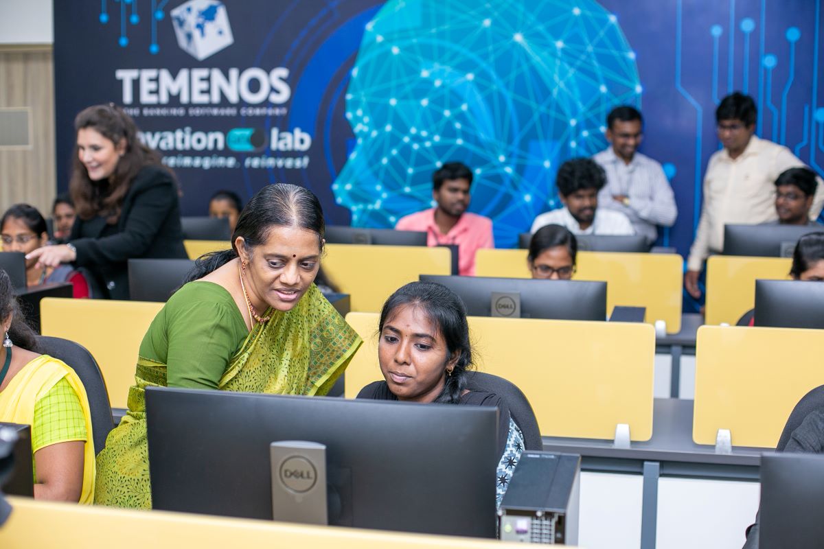 Young woman holding books, smiling slightly. Text: "Temenos Adopt-it Scholarship Program 2020, INR 70,000/year, Anna University, Chennai, engineering students."