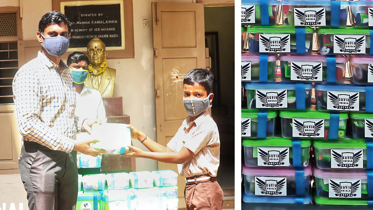 A man hands a box to a boy in school uniform, both wearing masks, indoors. Nearby, stacked gift boxes with "COVID Teens" labels convey support.