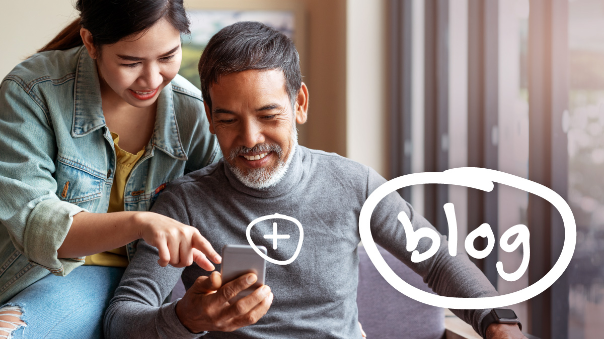 A woman and a man smile while looking at a smartphone together in a bright room. The word "blog" is written in white, conveying a sense of collaboration.