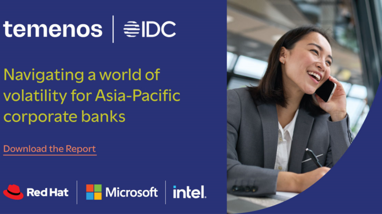 Smiling woman in a gray blazer talks on the phone, seated in a modern office. Text reads: "Navigating a world of volatility for Asia-Pacific corporate banks." Logos: Temenos, IDC, Red Hat, Microsoft, Intel.
