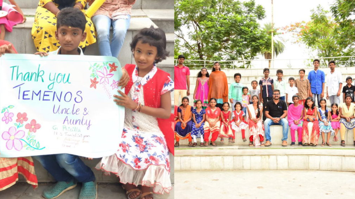 A group of children, some holding a colorful thank you sign, pose outdoors on steps. They express gratitude with smiles, conveying a joyful and appreciative tone.