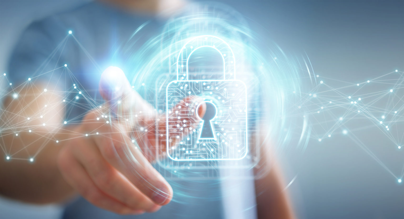 A person interacts with a digital holographic padlock, symbolizing cybersecurity. The futuristic blue glow and network lines convey security and technology.