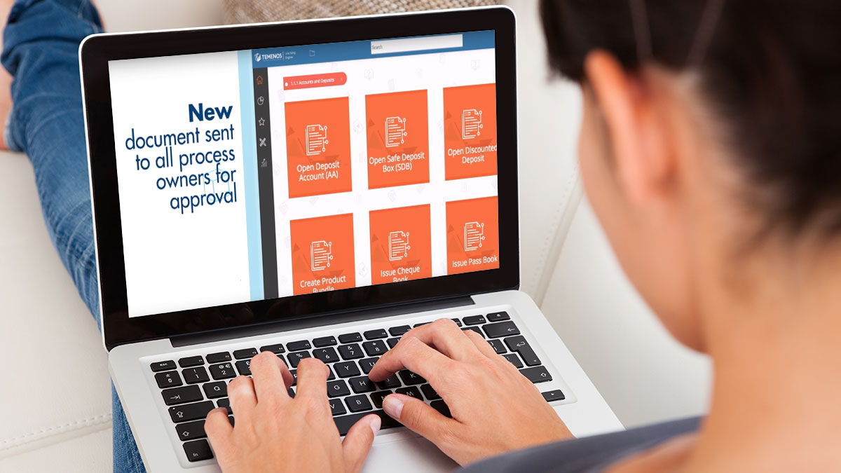 A person uses a laptop showing a software interface with tasks like "Open Deposit Account" and "New document sent for approval." They appear focused.