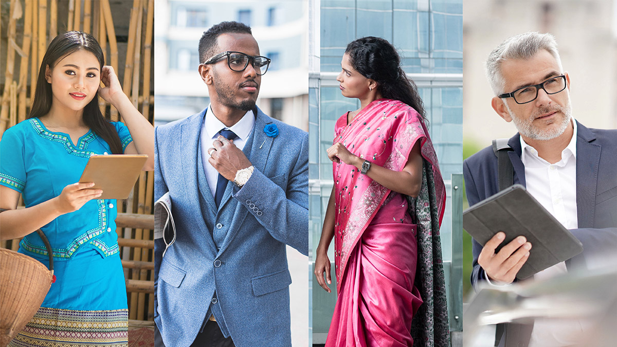 A diverse group of four professionals: a woman in blue traditional attire with a tablet, a man in a blue suit, a woman in a pink sari, and a man in a suit with a tablet.