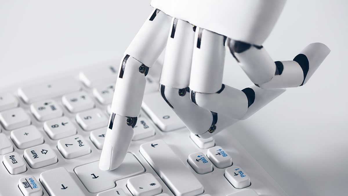 Robotic hand pressing keys on a white keyboard. The scene conveys technological advancement, with a focus on automation and AI integration.