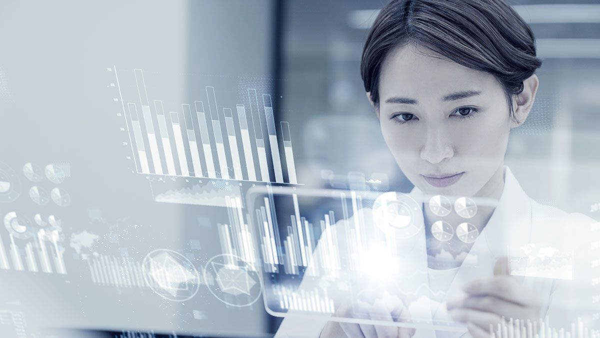 A woman in focus interacts with virtual data displays, including graphs and charts. The scene conveys a tech-savvy and analytical atmosphere.