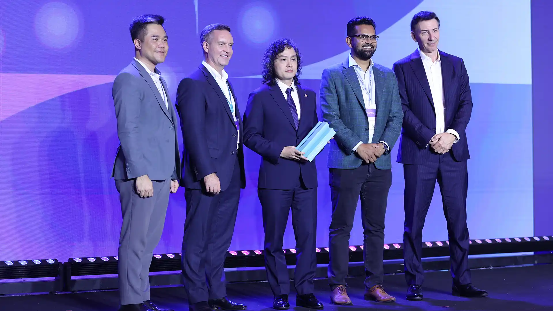 SACOMBANK’s Deputy CEO, Mr. Duc is honoured at Temenos Regional Forum 2026 with the Customer Impact Award. From left to right: Leo Binh, Account Director, Vietnam, Temenos (far left), William Dale, Managing Director Asia Pacific, Temenos (center left), Luu Danh Duc, Deputy Chief Executive Officer, Sacombank, Abhijit Roy, Head of Existing Business Emerging Asia (center right), and Takis Spiliopoulos, Chief Executive Officer, Temenos (far right).